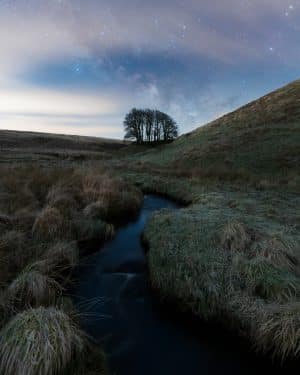 A fine art astrophotography print of the milky way at Three Combes Foot on Exmoor, Somerset
