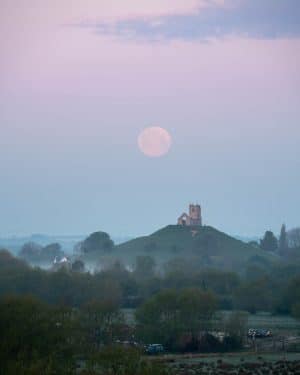A Fine Art Print of the 2021 Pink Supermoon at Burrow Mump in Somerset