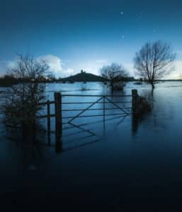 Burrow Mump in floods framed by a gate